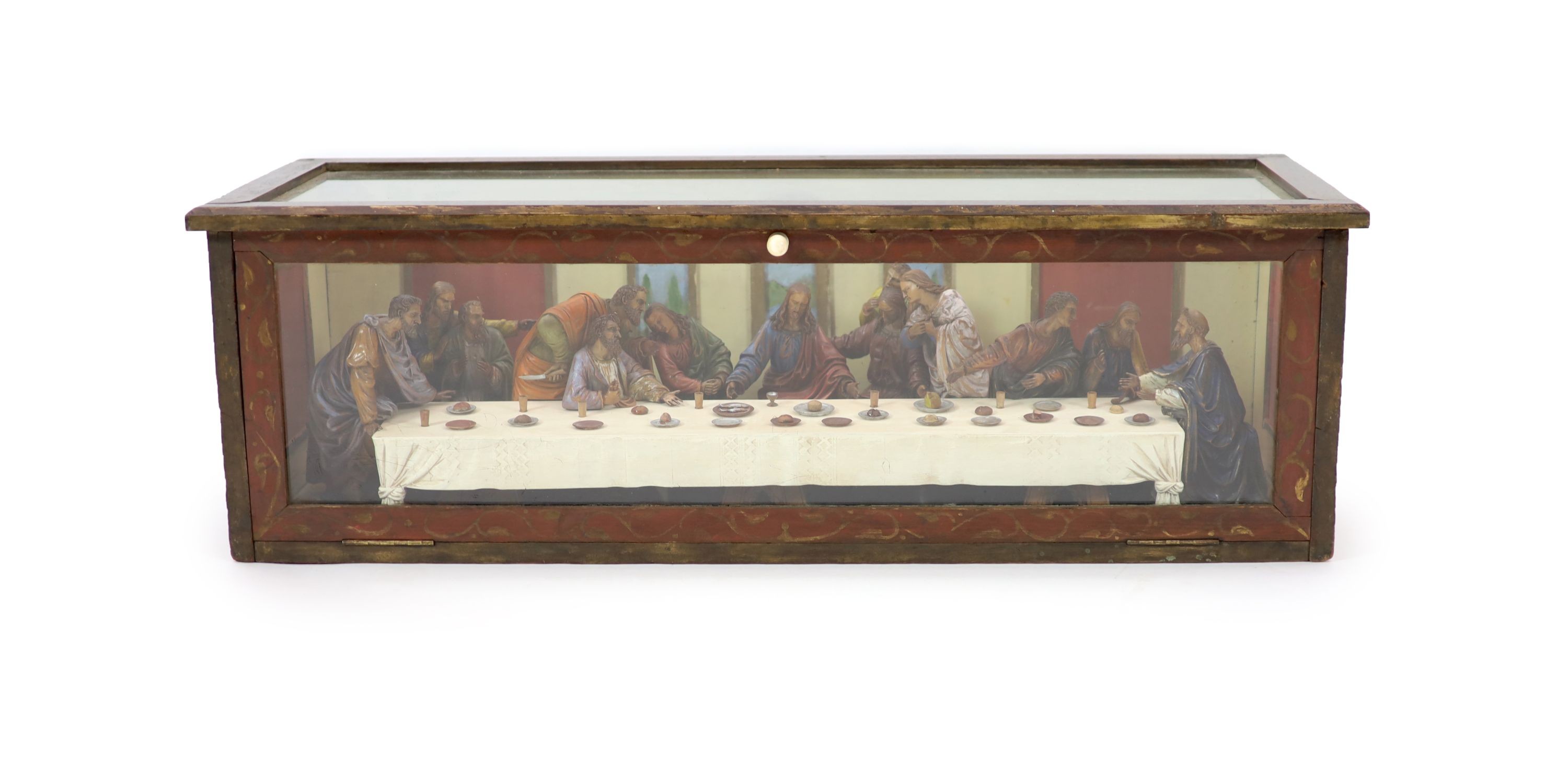 Attributed to Hans Mayr (active 1870) - a carved and painted limewood tableau of The Last Supper, after Leonardo da Vinci, dated 1872 32cm high, 94 x 33cm.